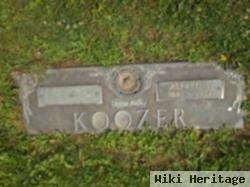 Grace L Koozer