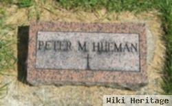 Peter M Huemann