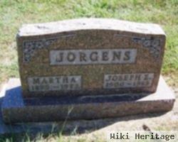 Joseph E Jorgens