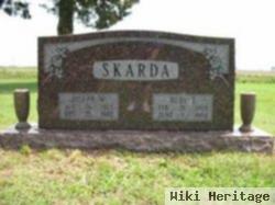 Joseph W Skarda