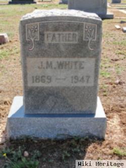 J M White