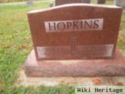 Lowell E Hopkins