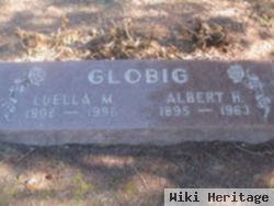 Luella M Globig