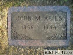 John M Aeils