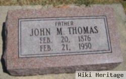 John M Thomas